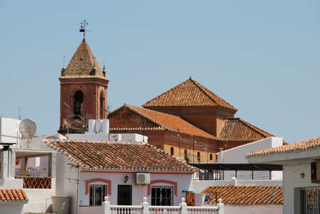 Townhouses with church to the rear, Torrox, Costa del Sol, Malaga Province, Andalucia, Spain, Western Europe の写真素材