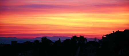 Mediterranean sunset over house rooftops, Costa del Sol, Malaga Province, Andalucia, Spain, Western Europe の写真素材