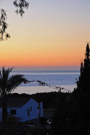 View over villa rooftop to the Mediterranean sea at sunrise, Calypso, Mijas Costa, Malaga Province, Costa del Sol, Andalucia, Spain, Western Europe の写真素材