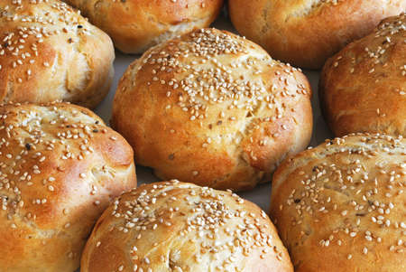 Homemade bread buns topped with sesame seeds, UK 