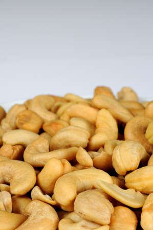Unsalted cashew nuts against a white background with copy space の写真素材