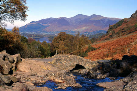 View of Bridge over Barrow Beck with Derwent Water to the rear, near Keswick, Borrowdale, Yorkshire Dales, England, Western Europe の写真素材