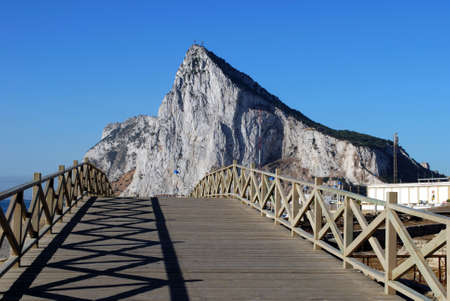 View across wooden footbridge towards the Rock of Gibraltar, La Linea de la Concepcion, Costa del Sol, Cadiz Province, Andalucia, Spain, Western Europe の写真素材