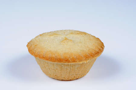 Single mince pie against a grey background の写真素材