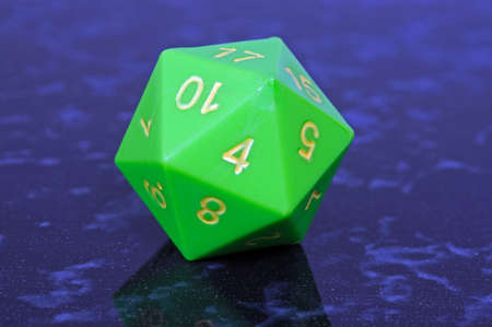 Green icosahedron 20 sided shaped numbered dice, England, UK, Western Europe の写真素材