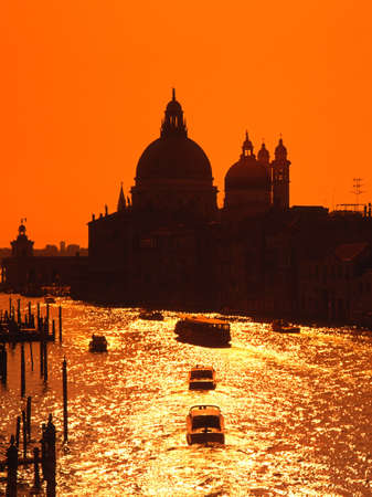 View along the Grand Canal at sunset, Venice, Veneto, Europe の写真素材