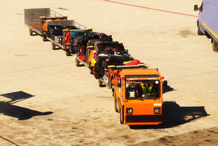 Baggage cart truck on the airport runway, Malaga, Andalusia, Spain, Western Europe 