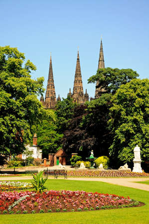 Flowerbeds in Beacon Park with the Cathedral Spires to the rear, Lichfield, Staffordshire, England, Western Europe の写真素材