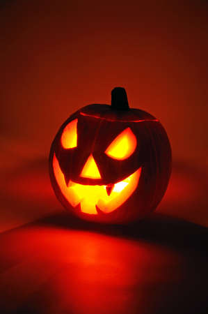 Scary face cut into pumpkin for Halloween  lit from the inside  の写真素材