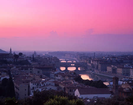 View over the city, Ponte Vecchio and River Arno at sunset, Florence, Tuscany, Italy, Europe の写真素材