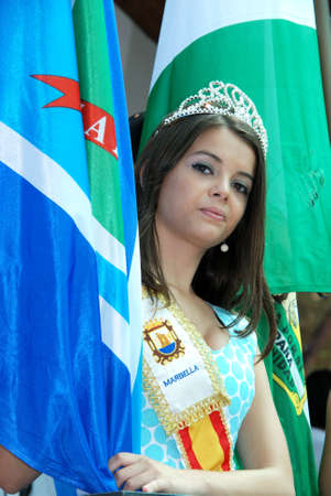 Marbella, Spain - June 8, 2008 - Carnival queen carrying a flag during Romeria San Bernabe Religious Festival, Marbella, Costa del Sol, Malaga Province, Andalucia, Spain のeditorial素材