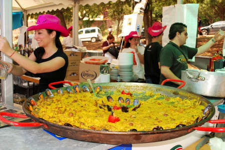 Marbella, Spain - June 12, 2008 - Large paella on a cafe bar counter during the Romeria San Bernabe Religious Festival, Marbella, Costa del Sol, Malaga Province, Andalucia, Spain のeditorial素材