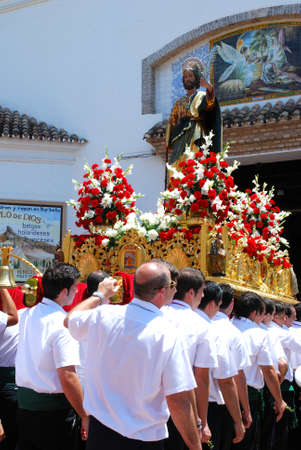 Marbella, Spain - June 11, 2008 - Carrying the float with statue of Saint Bernard into the church...