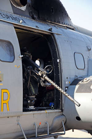 Malaga, Spain - September 4, 2010 - Spanish Air Force Puma Gunship Helicopter displaying machine gun at the second Malaga Air Show, Malaga Airport, Malaga, Costa del Sol, Malaga Province, Andalucia, Spain, Western Europe のeditorial素材