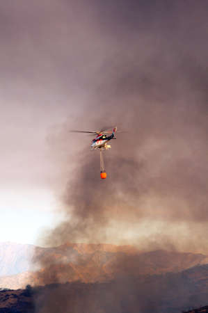 Cabopino, Spain - September 12, 2011 - Bell 412 helicopter  registration N167EH  taking water to brush fire, Cabopino Golf, Costa del Sol, Malaga Province, Andalucia, Spain, Western Europe  のeditorial素材
