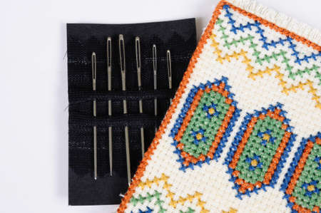 Tapestry embroidery needles in an embroidered tapestry case 