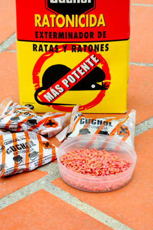 Andalusia, Spain - August 1, 2011 - Box of Spanish rat poison with poison in pot in foreground, Costa del Sol, Malaga Province, Andalucia, Spain, Western Europe のeditorial素材