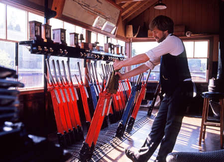 Bridgnorth, England - Circa June 1993 - Signal man operating points signal levers at Bridgnorth...