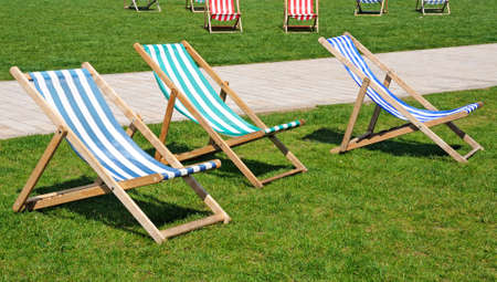 Colourful deckchairs in Bancroft gardens in front of the RSC, Stratford-Upon-Avon, Warwickshire, England, Western Europe の写真素材