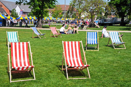 Stratford-upon-Avon, UK - May 18, 2014 - Colourful deckchairs in Bancroft gardens in front of the RSC, Stratford-Upon-Avon, Warwickshire, England, Western Europe のeditorial素材