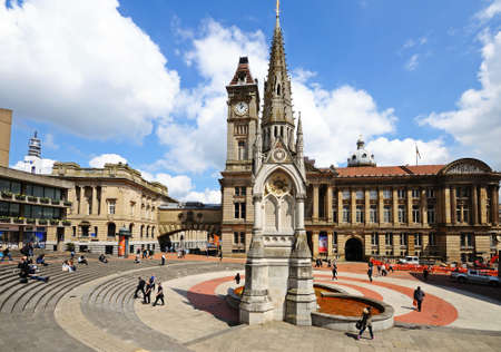 Birmingham, UK - May 14, 2014 - Chamberlain memorial in Chamberlain Square with the clock tower of Birmingham museum and art gallery to the rear, Birmingham, West Midlands, England, UK, Western Europe のeditorial素材