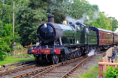 Hampton Loade, United Kingdom - June 5, 2014 - Great Western Railways 2-8-0 heavy goods locomotive number 2857 arriving Great Western railway station, Hampton Loade, Shropshire, England, UK, Western Europe   のeditorial素材