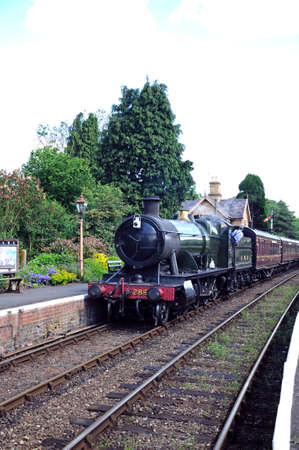 Hampton Loade, UK - June 5, 2014 - Great Western Railways 2-8-0 heavy goods locomotive number 2857 pulling up alongside Great Western railway station platform, Hampton Loade, Shropshire, England, UK, Western Europe のeditorial素材
