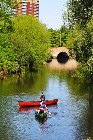 Tamworth, United Kingdom - May 17, 2014 - Canoes on the River Tame with a stone bridge to the rear, Tamworth, Staffordshire, England, UK, Western Europe のeditorial素材