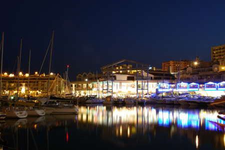 View of yachts and restaurants in the harbour at dusk, Benalmadena, Costa del Sol, Malaga Province, Andalucia, Spain, Western Europe の写真素材
