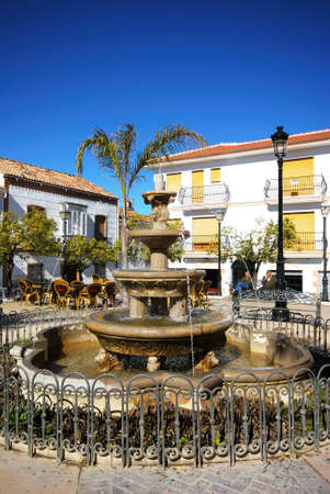 Colmenar, Spain - February 13, 2009 - Fountain and pavement cafes in the town square, Colmenar, Andalusia, Spain, Western Europe のeditorial素材