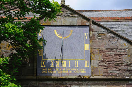 Sundial on St Peter and St Paul church, Weobley, Herefordshire, England, UK, Western Europe の写真素材