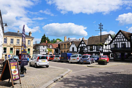 Leominster, United Kingdom - June 5, 2014 - View of building and businesses around Corn Square with parked cars in the centre, Leominster, Herefordshire, England, UK, Western Europe のeditorial素材