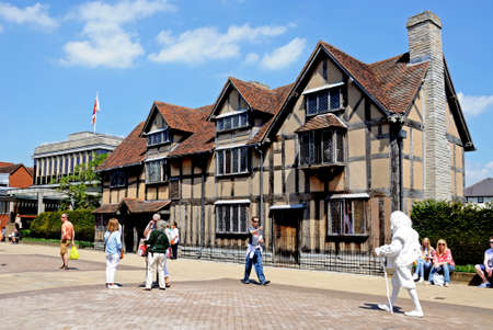 Stratford-upon-Avon, UK - May 18, 2014 - Shakespeares Birthplace along Henley Street with Shakespeares ghost in foreground, Stratford-Upon-Avon, Warwickshire, England, United Kingdom, Western Europe のeditorial素材