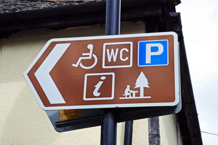 Pembridge, UK - June 5, 2014 - Tourist information sign against a white building, Pembridge, Herefordshire, England, UK, Western Europe のeditorial素材