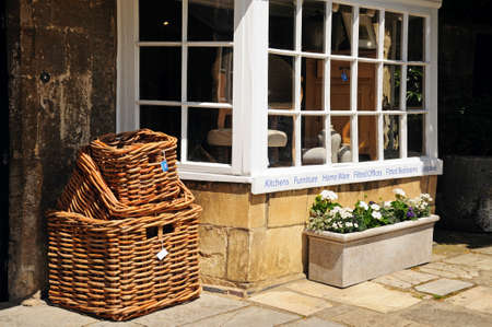 Broadway, UK - June 12, 2014 - Wicker baskets for sale outside a shop along High Street, Broadway, Cotswolds, Worcestershire, England, UK, Western Europe のeditorial素材