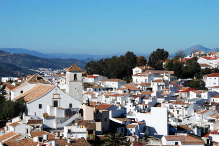 View over the town rooftops towards the church  Iglesia de Nuestra Senora de la Asuncion , Colmenar, Andalusia, Spain, Western Europe の写真素材