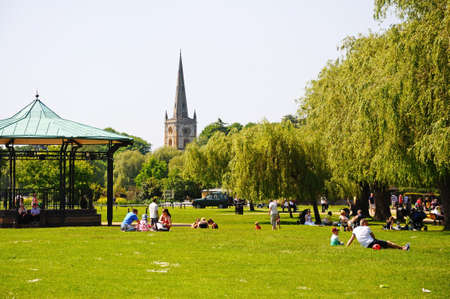 Stratford-upon-Avon, UK - May 18, 2014 - Bandstand in Bancroft Gardens with the Holy Trinity Church spire to the rear, Stratford-Upon-Avon, Warwickshire, England, Western Europe のeditorial素材