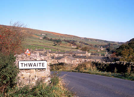 View of the village and surrounding countryside, Thwaite, Yorkshire Dales, North Yorkshire, England, UK, Great Britain, Western Europe の写真素材