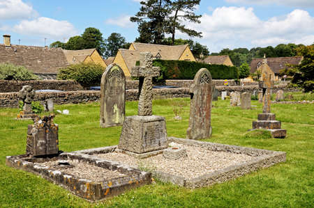 Lower Slaughter, UK - June 12, 2014 - Gravestones in St Marys churchyard, Lower Slaughter, Cotswolds, Gloucestershire, England, UK, Western Europe のeditorial素材