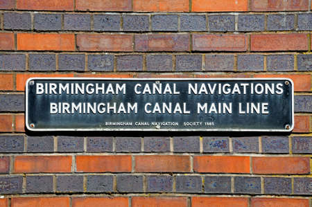 Birmingham, United Kingdom - May 14, 2014 - Birmingham Canal Main Line sign on a brick wall, Gas...