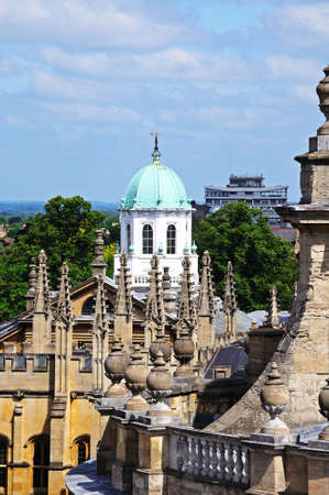 View over the city rooftops from the University church of St Mary spire featuring the Sheldonian theatre dome, Oxford, Oxfordshire, England, UK, Western Europe のeditorial素材