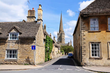 Burford, UK, June 17, 2014 - St John the Baptist church seen from the High Street, Burford,...
