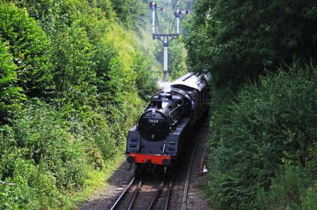 Arley, UK - July 10, 2014 - Steam Locomotive British Rail Standard Class 5 4-6-0 number 73129 in British Rail Black approaching the railway station, Severn Valley Railway, Arley, Worcestershire, England, UK, Western Europe のeditorial素材