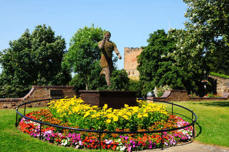 Tamworth, UK - July 23, 2014 - Floral statue at the centre of a round flowerbed within the castle...