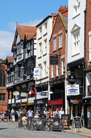 Chester, UK - July 22, 2014 - Pavement cafe outside old shops and buildings along Bridge Street, Chester, Cheshire, England, UK, Western Europe.のeditorial素材