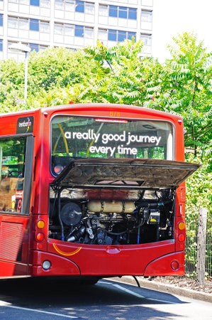 Nottingham, UK - July 17, 2014 - Broken down bus with it?s engine compartment open for inspection,...