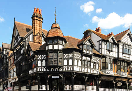 Chester, UK - July 22, 2014 - The rows shops on the corner of Eastgate Street and Bridge Street, Chester, Cheshire, England, UK, Western Europe.のeditorial素材