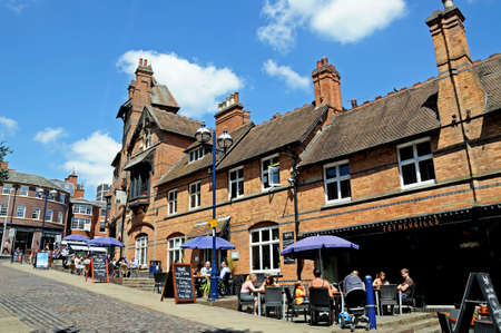 Nottingham, UK - July 17, 2014 - People relaxing at tables outside Fothergills pub (named after building designer Watson Fothergill, built in 1883) opposite the castle entrance, Castle Road, Nottingham, Nottinghamshire, England, UK, Western Europe.のeditorial素材