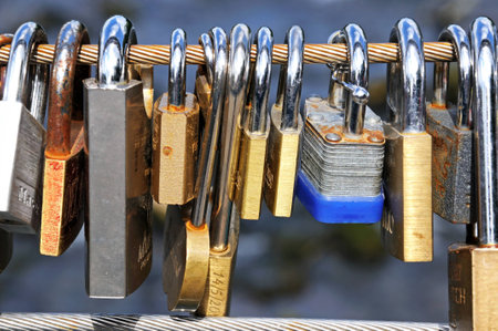 Bakewell, UK - September 7, 2014 - Love locks attached to the cable bridge, Bakewell, Derbyshire,...
