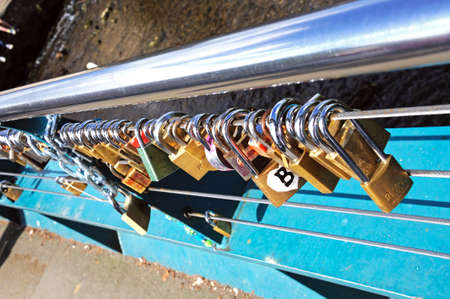 Bakewell, UK - September 7, 2014 - Love locks attached to the cable bridge, Bakewell, Derbyshire, England, UK, Western Europe.のeditorial素材